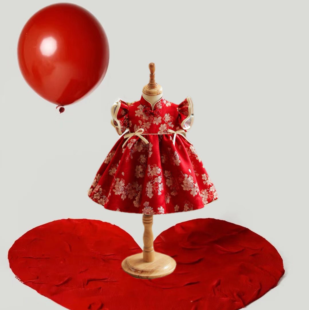 Red Chinese Qipao Baby Princess Dress with Gold Floral Embroideries by Ashberryco. Features a traditional qipao design with a high mandarin collar, vibrant red fabric, and intricate gold floral embroidery, perfect for Chinese New Year and cultural celebrations.