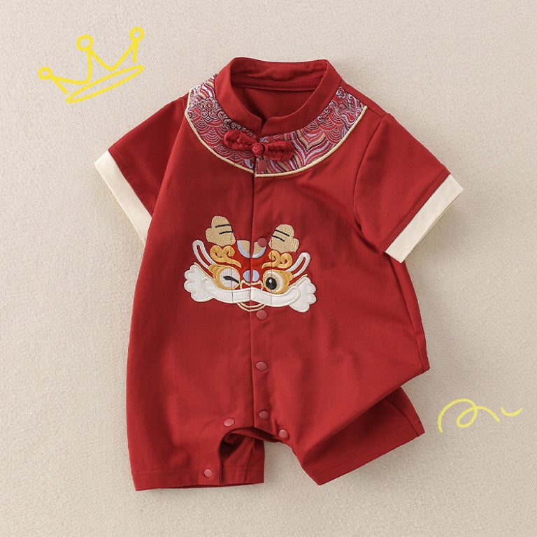 Red Chinese baby romper by Ashberryco with dragon embroidery, mandarin collar, and frog button details, ideal for baby 100 days, baby boy first birthday outfit, or attending a traditional Chinese wedding.