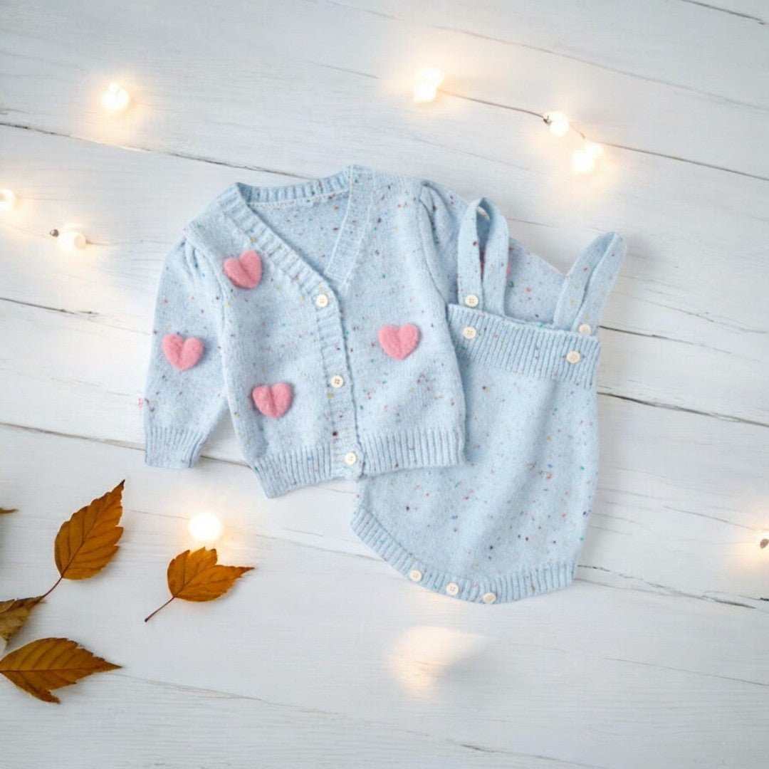 A two piece fall winter newborn outfit for baby girl, featuring cute 3D pink hearts and a cozy knitted fabric. Ashberryco is here to ensure your little one stays warm while celebrating all the holiday festivities!